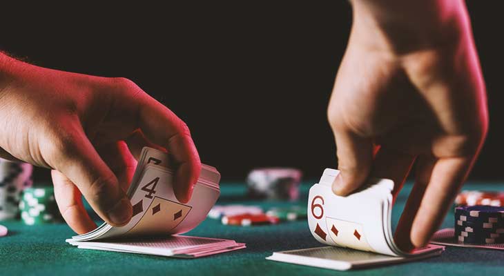 Croupier in a Land-based Casino dealing cards